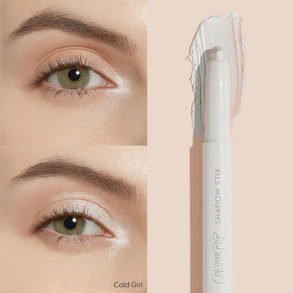 ColourPop Shadow Stix in Cold Girl highlighting eyelids - creamy twist-up stick swipes a frosty pearl shimmer across the lid and inner corner, shown on an eye with a side swatch and the white pen-style Shadow Stix packaging.