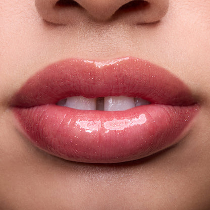 Close-up swatches of Colourpop Fresh Kiss Glossy Balm in Chocolate Cherry on lip tones, showing sheer berry shine with subtle shimmer, promoting Lip Gloss & Lip Oil finish and smooth, hydrated lips.
